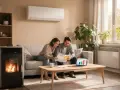 Un couple examine des factures près d'un poêle à granulés, symbole d'un chauffage économique et écologique.