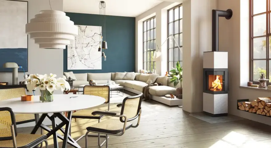 Poêle à bois moderne dans un salon lumineux avec canapé et table à manger.